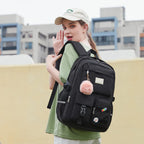 Lucia Large Black Laptop Backpack for College with Pom-Pom Charm and Luggage Strap